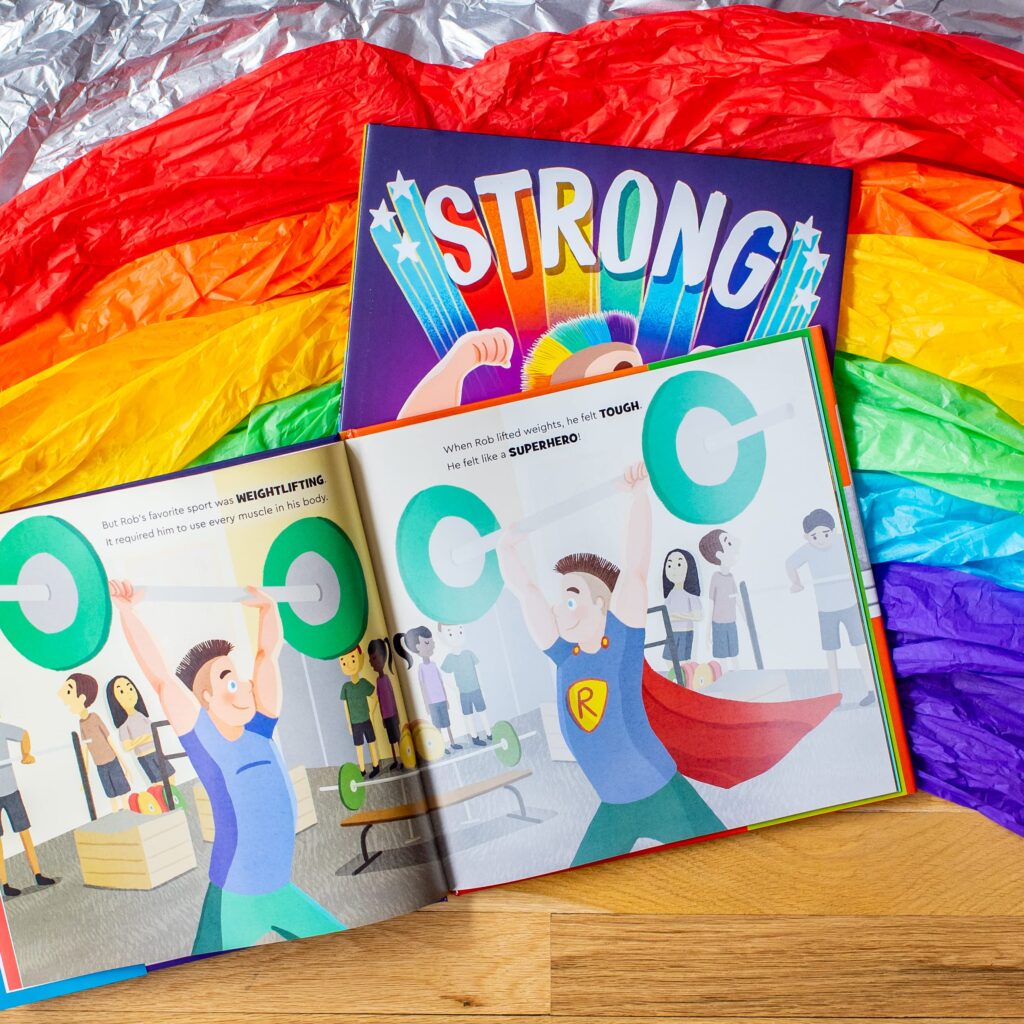 Strong is an illustrated book on the story of the first openly gay Strongman, Rob Kearney and the blending of his sport and his style.