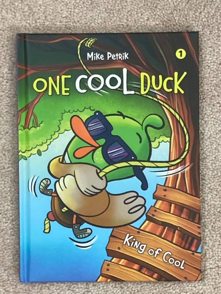 One Cool Duck is a graphic novel series aimed at very young readers. King of Cool is the first entry in it that’ll charm pre-k and up.  